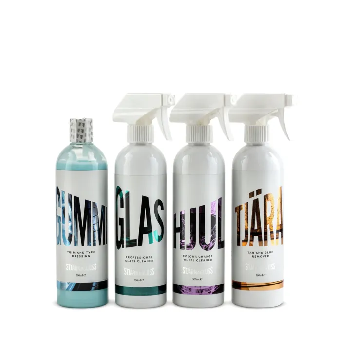Four cleaning product bottles line up against a white background. Each bottle has a distinct label: "GUMMI Trim and Tyre Dressing," "GLAS Professional Glass Cleaner," "HJUL Colour Change Wheel Cleaner," and "TJÄRA Tar and Glue Remover." Brand "STJARNAGLOSS" is printed below the product names.