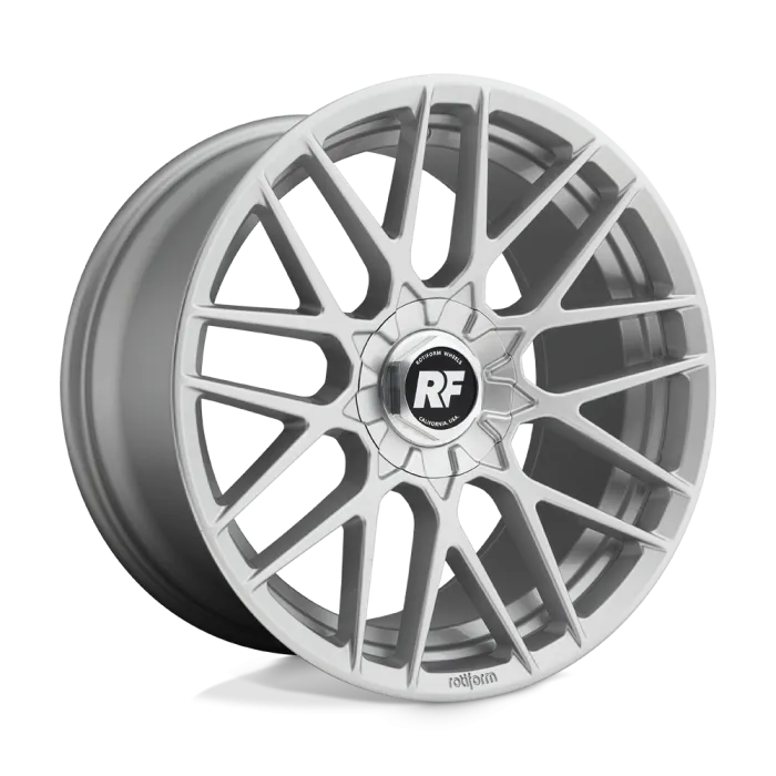 A silver alloy wheel with a multi-spoke design featuring "RF" in the center cap. Context: A studio setting with a plain background. Text: "ROTIFORM WHEELS CALIFORNIA U.S.A." and "rotiform."