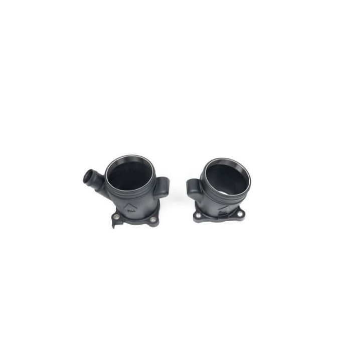 Two black, cylindrical car parts with mounting flanges, displayed side by side on a white background. The left part has an additional side outlet pipe.