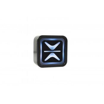 A black, rectangular device with rounded corners displays a blue, glowing abstract emblem on its front surface. The background is plain white.